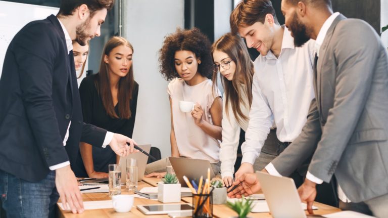 People in a meeting discussing meetings